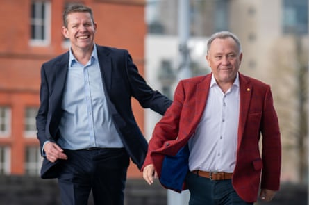 Rhun ap Iorwerth smiles as he walks alongside Lindsay Whittle