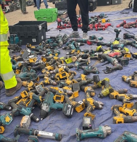 Battered tools on a tarpaulin.