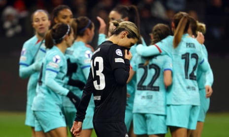 Eintracht Frankfurt's Virginia Kirchberger looks dejected as Barcelona's Salma Paralluelo celebrates scoring their third goal with teammates.