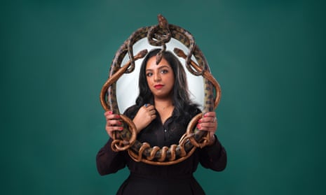 Anita Bhagwandas with mirror made from coiled serpents