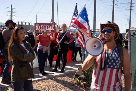 Demonstrators gathered to protest midterm election results outside of Maricopa county election center in Phoenix, Arizona