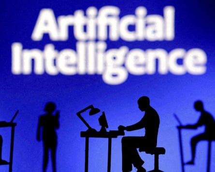 Figurines with computers and smartphones are seen in front of the words “Artificial Intelligence AI”