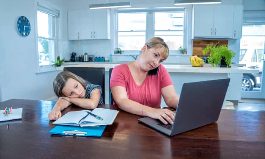 Stressed mother working from home coping with work and bored daughter in quarantine.