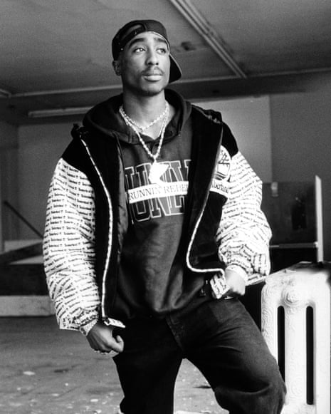 black and white image of Tupac Shakur posing for a photo near a window Archives) (Photo by MediaNews Group/Bay Area News via Getty Images)