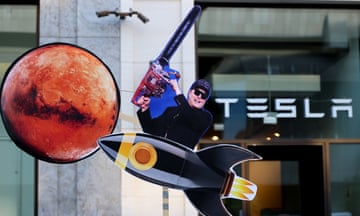 a protest outside a Tesla branch