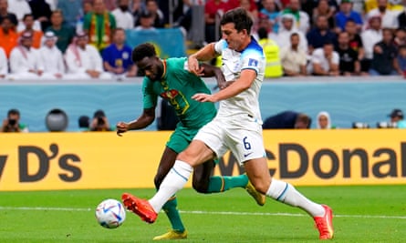 Harry Maguire challenges Senegal's Boulaye Dia in the last-16 tie.