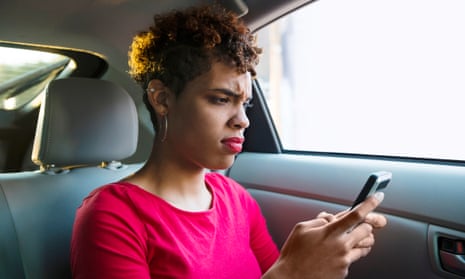 Annoyed Millennial Passenger Makes a Face while Texting