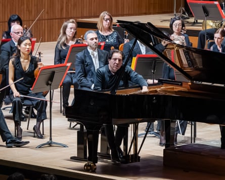 Composer and pianist Fazil Say reaches in to manipulate the strings directly.