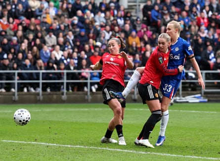 Aggie Beever-Jones gets her shot away to score Chelsea’s second goal against Manchester United