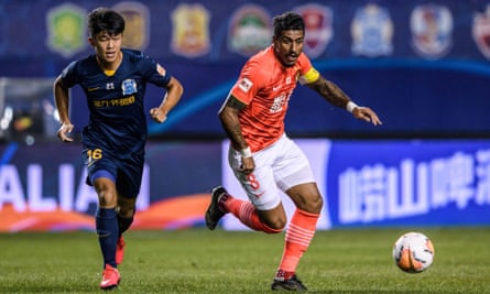 Paulinho (right) was one of the star names at Guangzhou Evergrande but eventually had his contract cancelled last year due to pandemic-related complications.