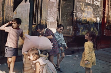 five children play in a graffiti’d street