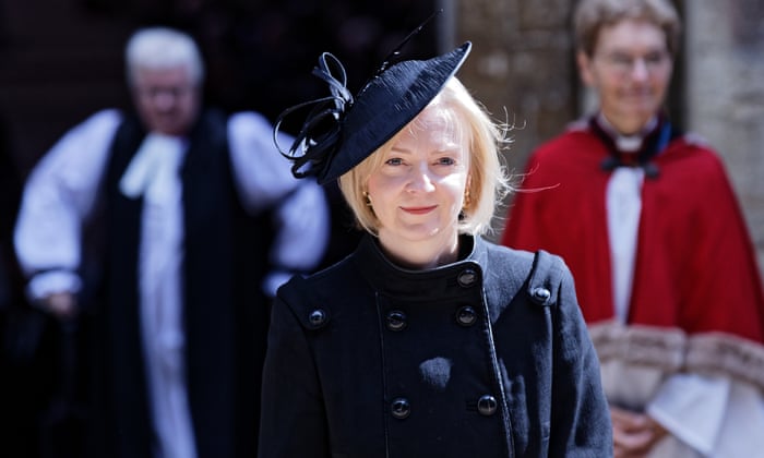 The prime minister, Liz Truss, exits Llandaff Cathedral in Cardiff on Friday after a service of prayer and reflection for the life of the Queen.