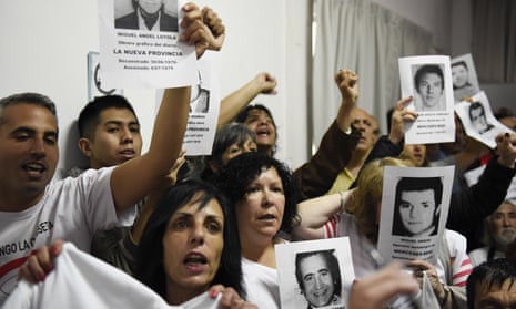 Family members of ex-Ford Motor Co employees watch the sentencing of former executives in Buenos Aires, Argentina, on 11 December. 