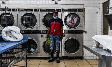 Gregory Stark, 54, an employee at a laundromat poses for a picture in Miami on 17 April 2020. Workers of color, particularly black Americans, have long been overrepresented in the lowest-paying service and domestic occupations.