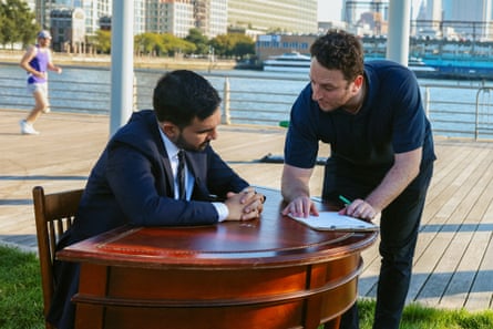 a man speaks with another man