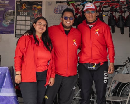 two men and a woman standing together