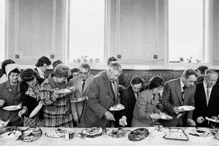 Black-and-white photograph of a banquet by Martin Parr from 1977.