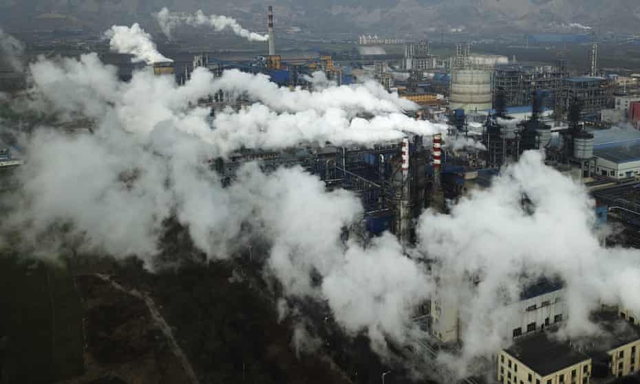 Smoke and steam rise from a coal processing plant in central China's Shanxi province.