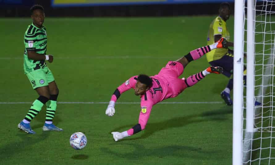 Forest Green's Jojo Wollacott dives to save from Coventry's Amadou Bakayoko in October 2019