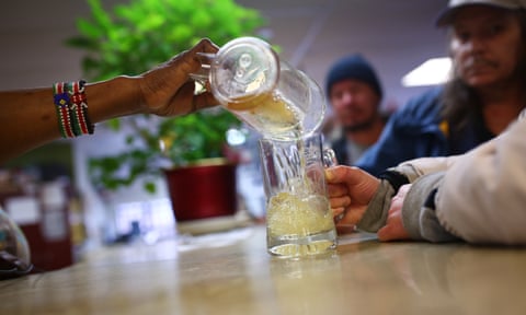The alcoholic residents of the Oaks shelter for the homeless, in Ottawa, queue up to get their hourly pour of homemade wine.