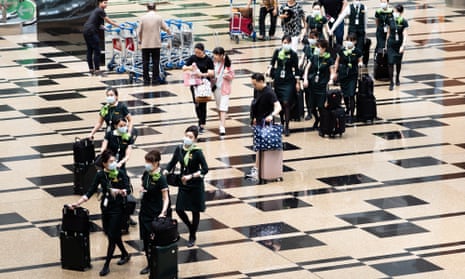 Visitors wear masks at Changi airport, Singapore, on Friday.