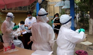 Residents undergo nucleic acid testing during the Covid-19 epidemic on 19 July 2020 in Urumqi, Xinjiang, China.