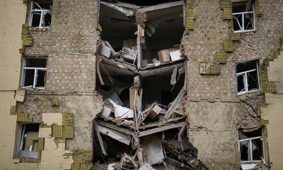 FILE - Debris hangs from a residential building heavily damaged in a Russian bombing in Bakhmut, eastern Ukraine, eastern Ukraine, Saturday, May 28, 2022. (AP Photo/Francisco Seco, File)
