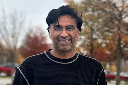 person wearing glasses and black shirt