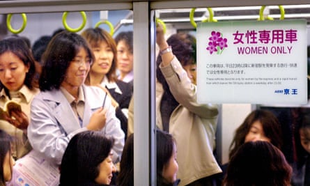 Female passengers wait to leave Tokyo’s Shinjuku station.