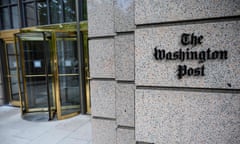 The Washington Post logo is seen outside its headquarters.