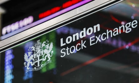 The London Stock Exchange logo in front of FTSE 100 information in