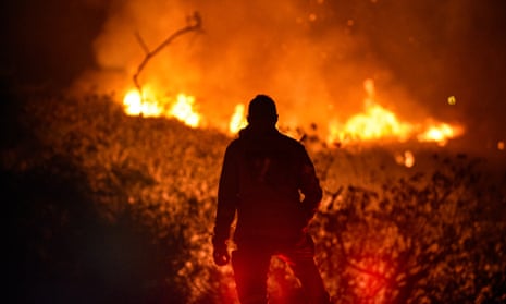 A firefighter tries to control a wildfire in the hills at Cali, Colombia on 22 September.