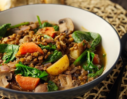 Green lentil stew with carrots, mushrooms and greens.