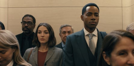 A man and a woman in a packed lift