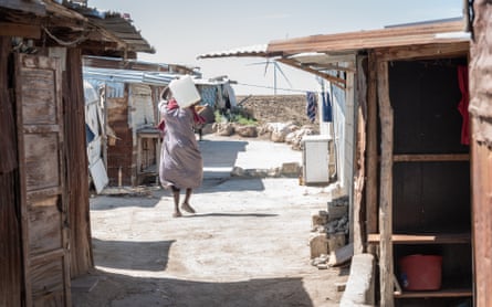 A woman carrying drinking water.