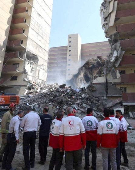 Rescuers at the site of an Israeli strike in Tehran.
