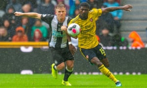 Matt Ritchie battles Ainsley Maitland-Niles for the ball during Newcastle's game against Arsenal.