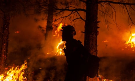 A firefighter during operations to contain the Bootleg fire, which has been raging out of control across Oregon for weeks and has spread to an area 25 times the size of Manhattan. 