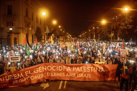 Thousands of demonstrators protesting against the Israeli attacks against Gaza in response to the attack by the Islamist movement Hamas from October 7 enlighten their mobile phones during a demonstration in support of the Palestine people. Barcelona, Spain - 11 Nov 2023