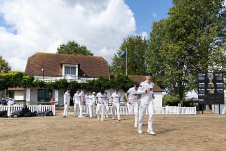 Middlesex march out onto the parched grass of Merchant Taylor’s School
