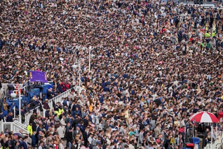 Packed crowds attend Ladies’ Day at Aintree.