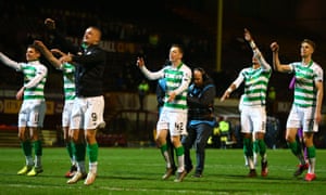 Celtic players celebrate with their fans after their 4–0 win at Motherwell.