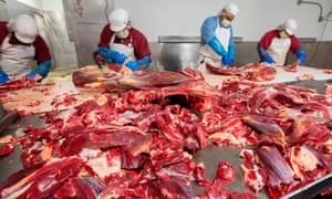 Butchers chop up beef at a plant in Rigby, Idaho, 26 May 26, 2020.