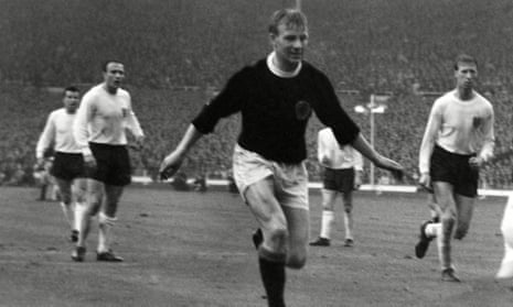 Davie Wilson in action for Scotland against England at Wembley Stadium in April 1965