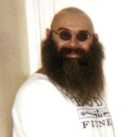 Bronson with bald head, John Lennon specs and bushy beard in 1997.