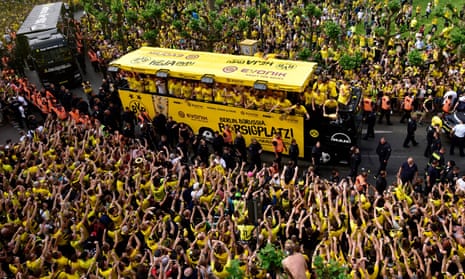Borussia Dortmund fans and players celebrate at Borsigplatz after their triumph in the German Cup final.