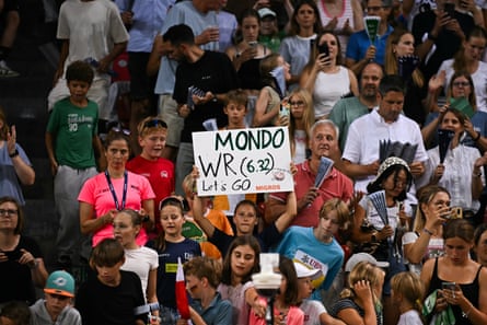 A fan holds a sign urging Armand Duplantis towards a world record as the Swede attempts 6.32m after winning the men’s pole vault at the Diamond League meeting in Zurich.