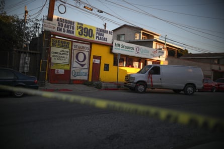 A white forensic van waits to remove the body of Brianna Rojas from her Tijuana workplace  after she was murdered there on 8 October, 2019