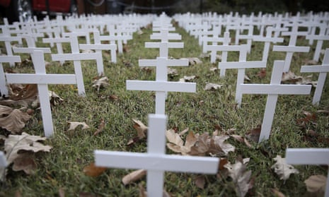 A yard in Oklahoma bears 1,006 white crosses, representing the state’s coronavirus death toll.