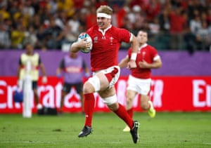 Aaron Wainwright runs in to score for Wales.